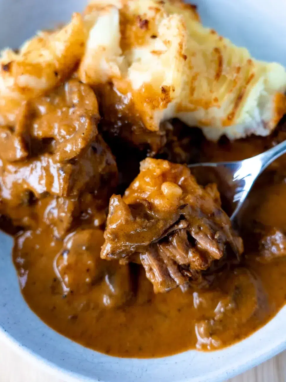 The beef stroganoff filling in this cottage pie is cooked low and slow for 21/2 hours, resulting in meat that is melt-in-the-mouth tender.
