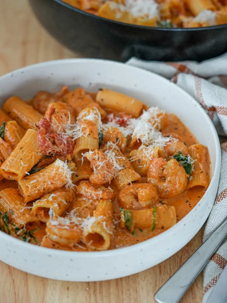 Creamy Cajun Prawn Pasta served in a bowl, ready to eat.