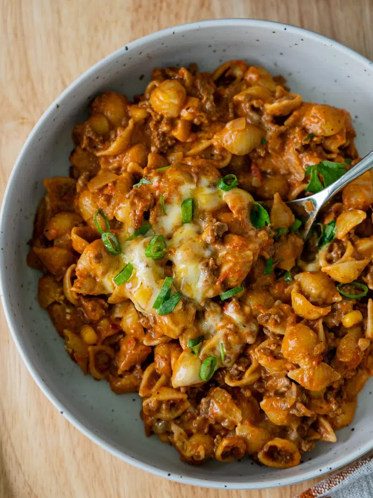 Top view of plated one-pan taco mac and cheese and fork